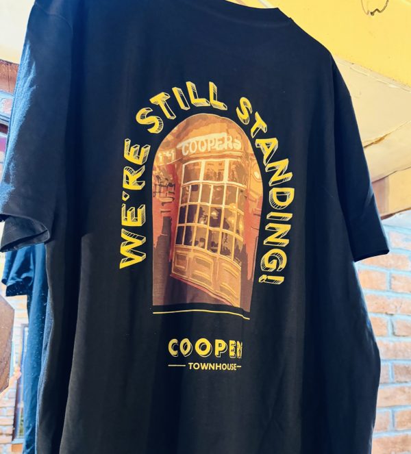 T-Shirt - Black Double Sided “100 Years, We’re Still Standing” - Image 4